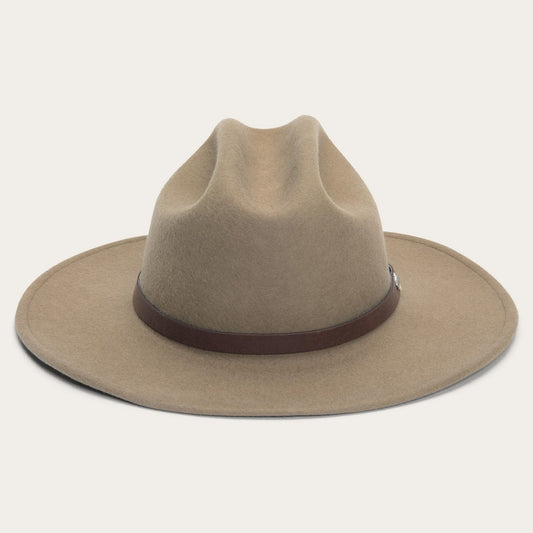 Beige cowboy hat with a brown band on a light gray background