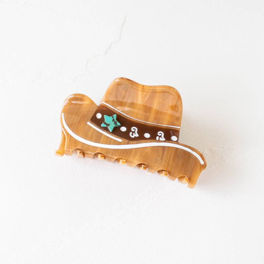 Decorative boot ornament with a cowboy hat on a white background