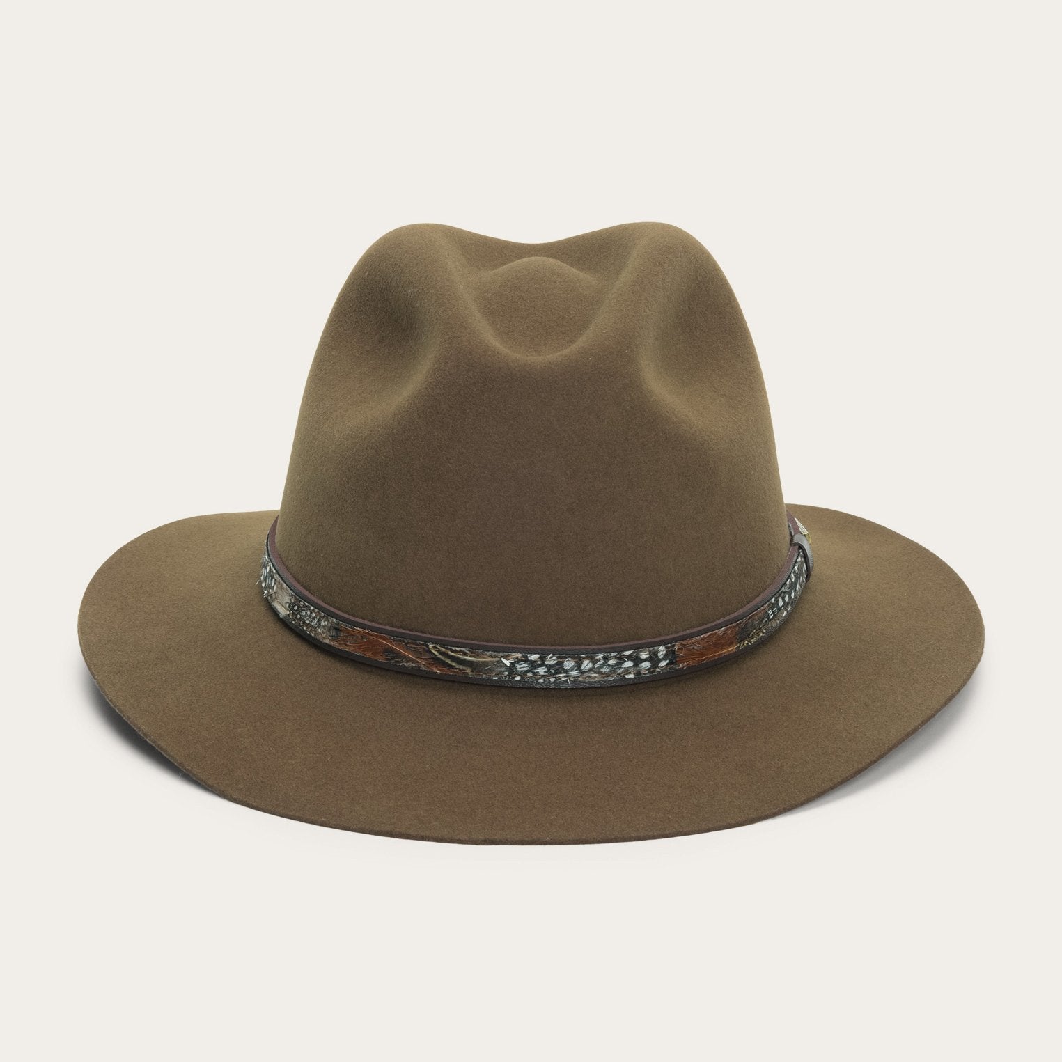 Brown fedora hat with a decorative band on a light gray background