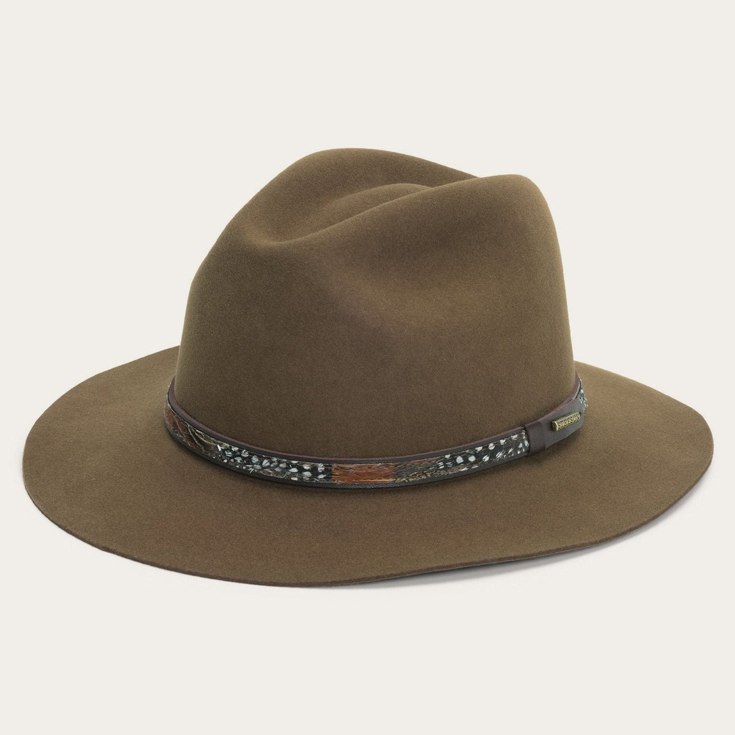 Brown fedora hat with a decorative band on a white background