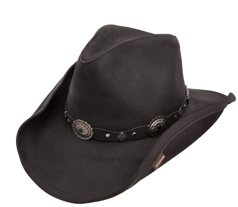 Black cowboy hat with a leather band and concho on a white background